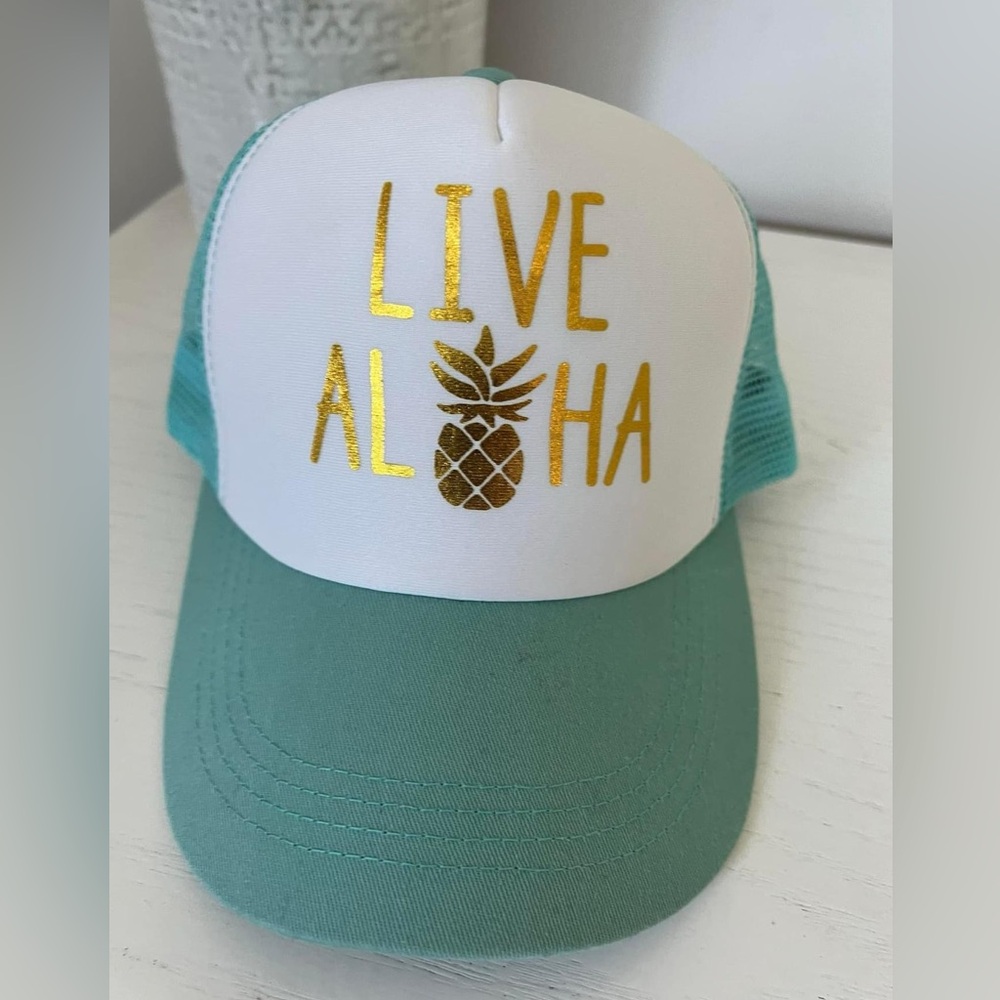Live Aloha trucker hat. Turquoise with gold lettering.